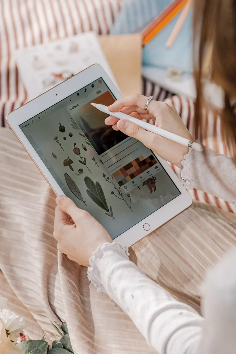 Designer sketching a website layout on a tablet