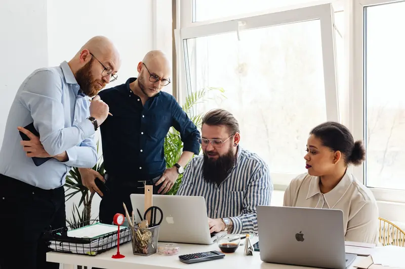 Team reviewing a project together at a desk